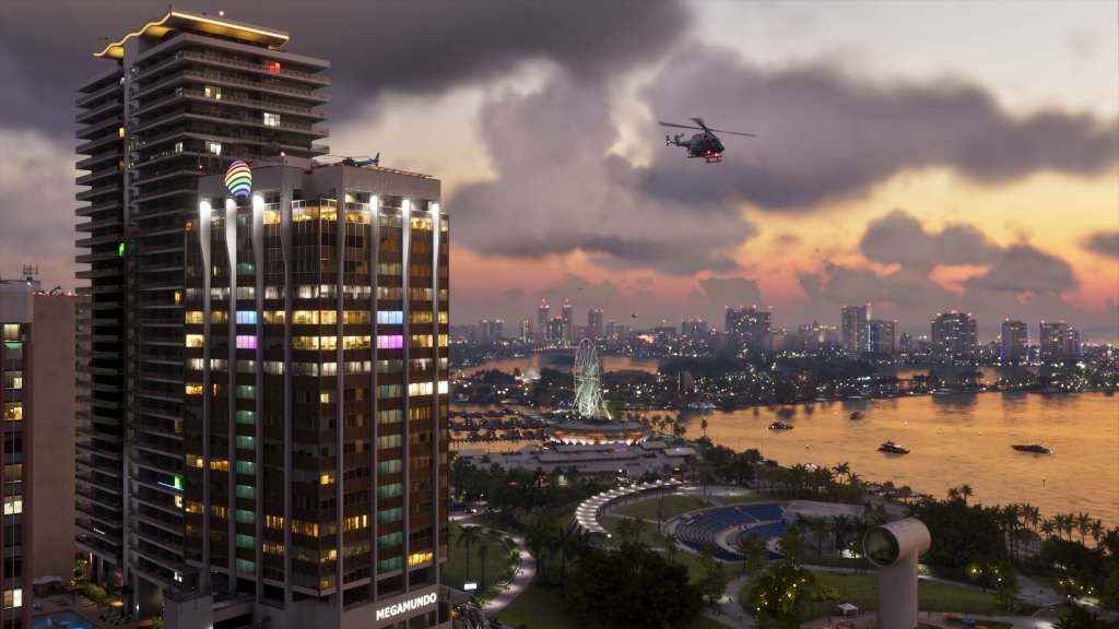 A helicopter above Vice City's illuminated waterfront at sunset in official GTA VI imagery.